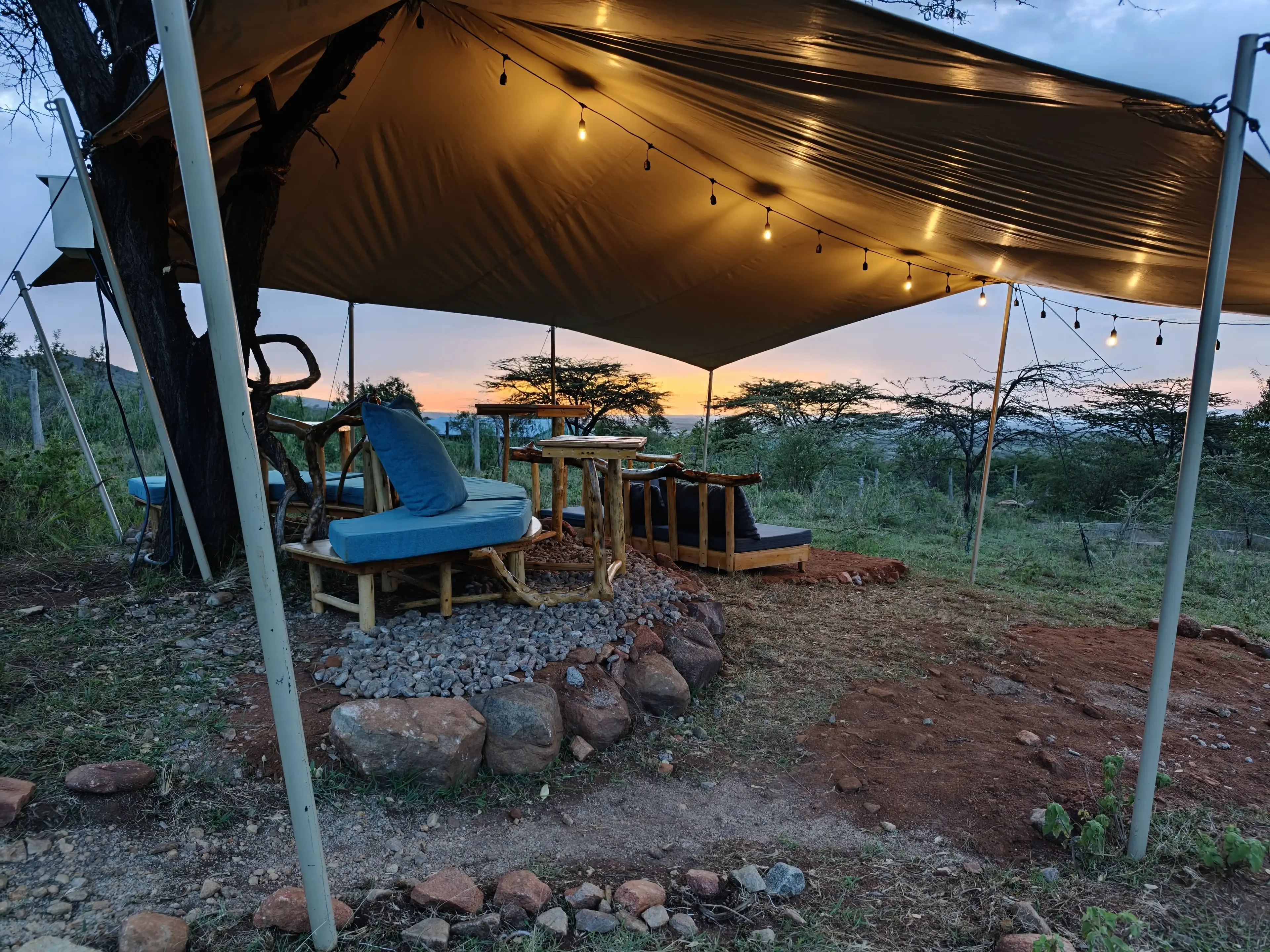 The co-working canopy with string lights and lounge seating